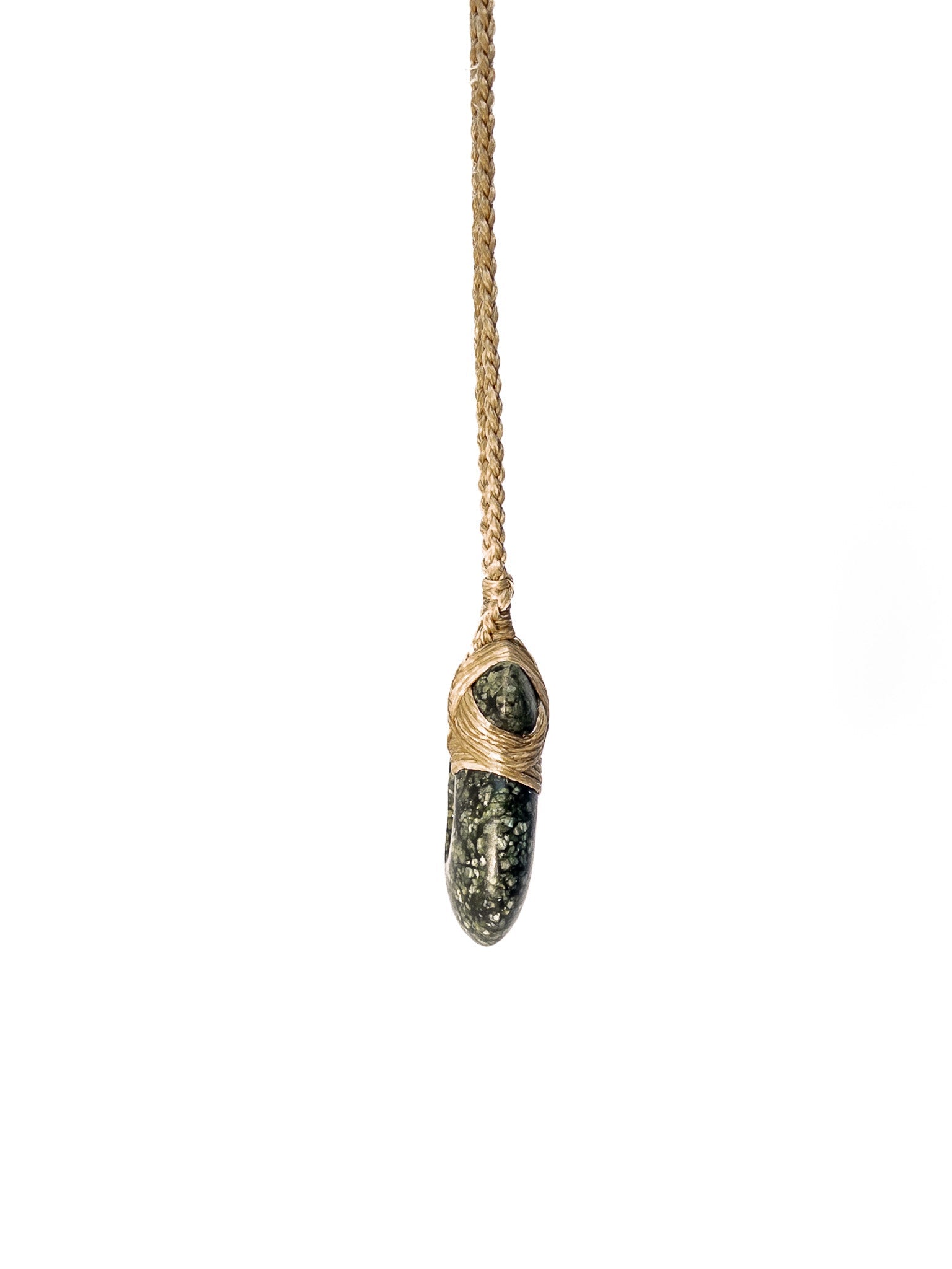 Pounamu Fishhook on plain background