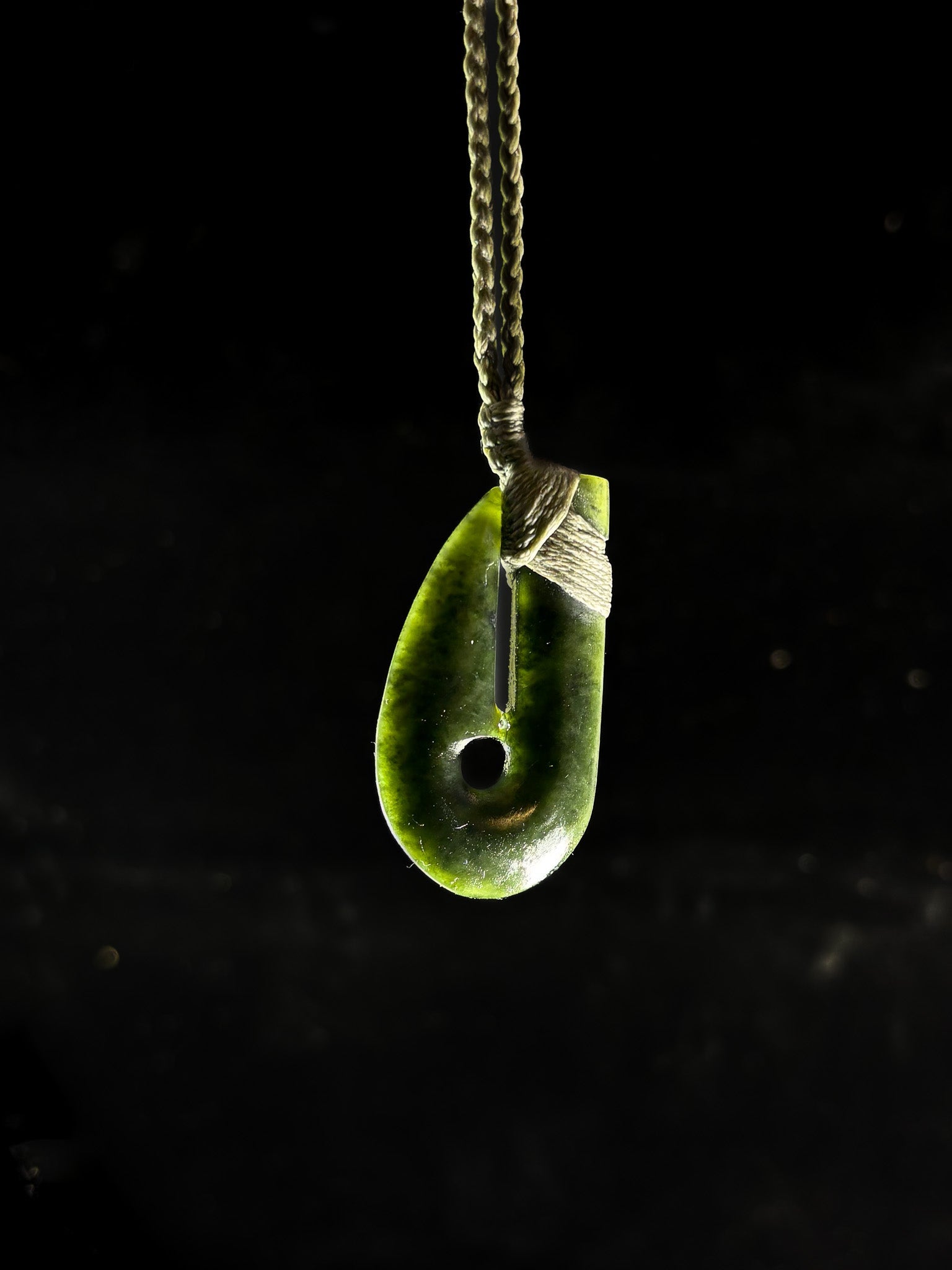 Pounamu Hei matau Fish hook on plain background