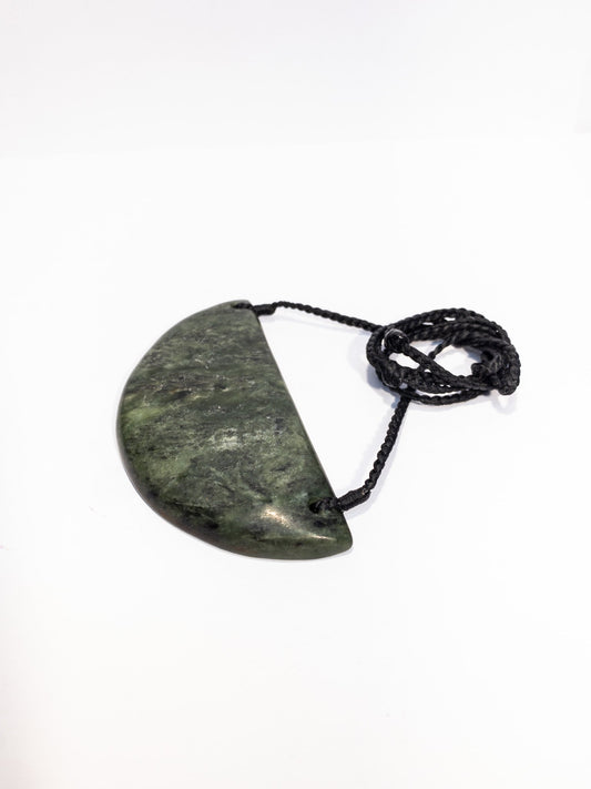 Pounamu Breastplate on plain background