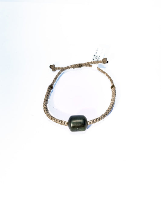 Pounamu bracelet on plain background