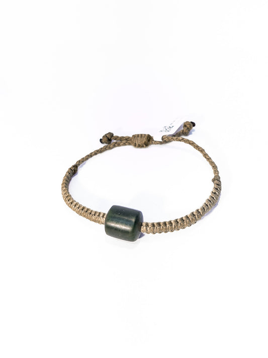 Pounamu bracelet on plain background