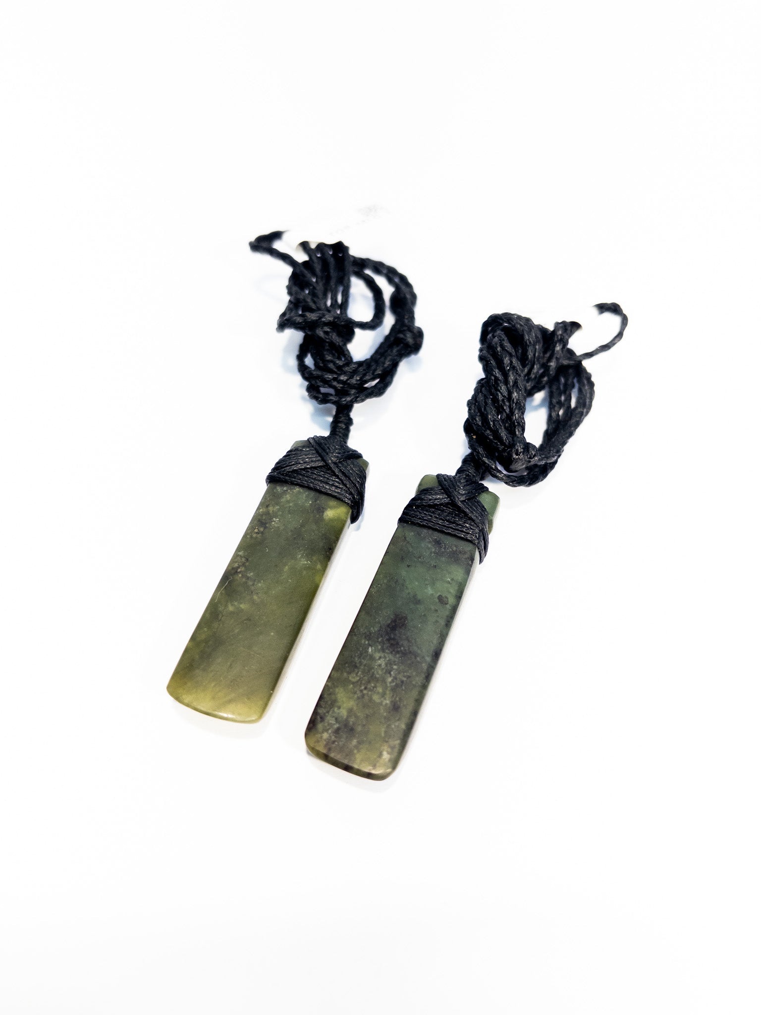 Pounamu pendant on plain background