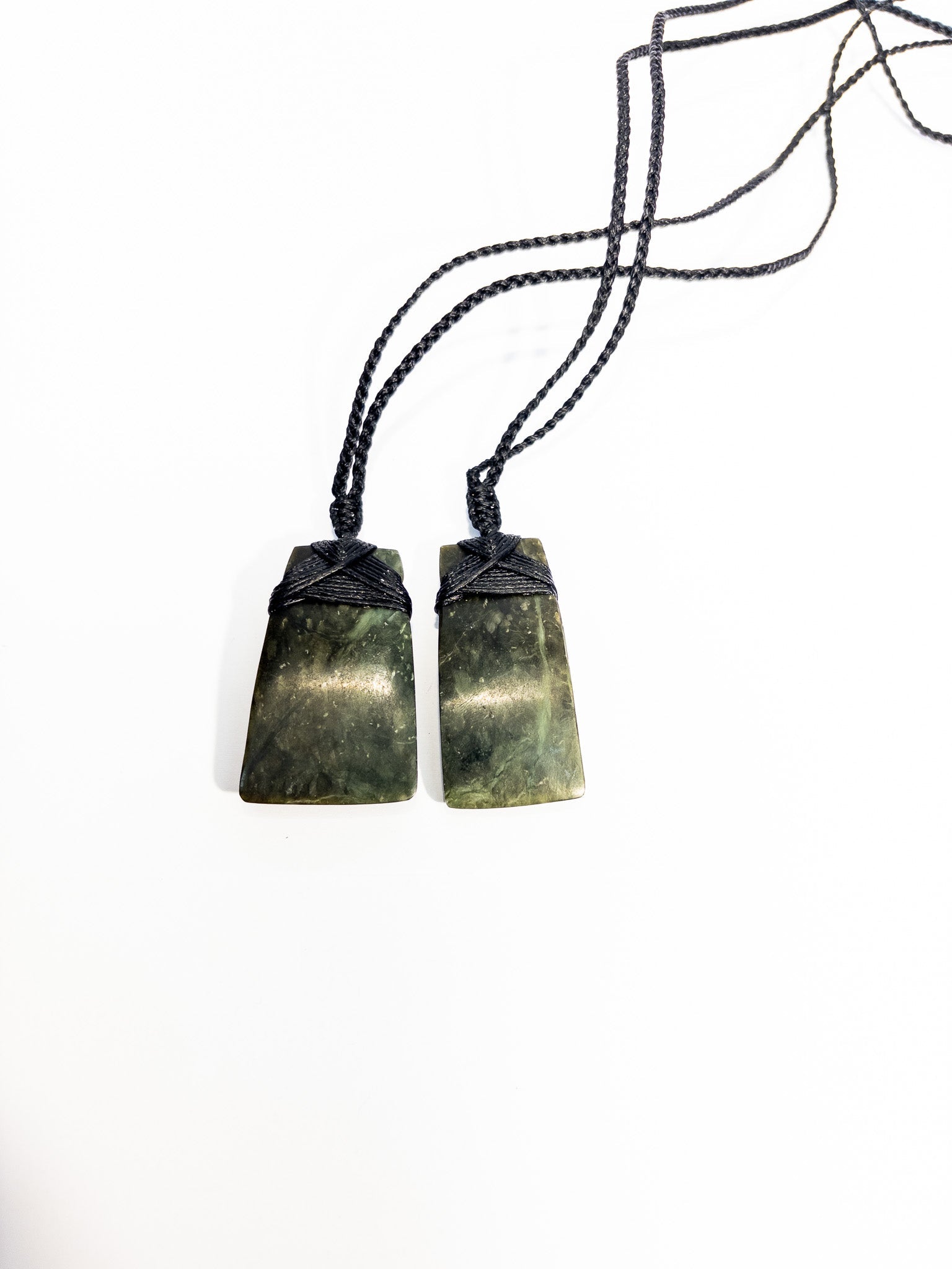 Pounamu pendant on plain background