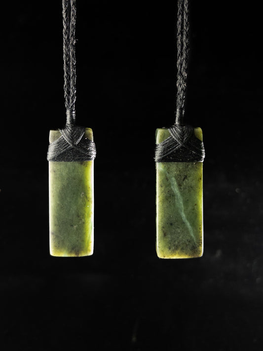 Pounamu pendants on plain background