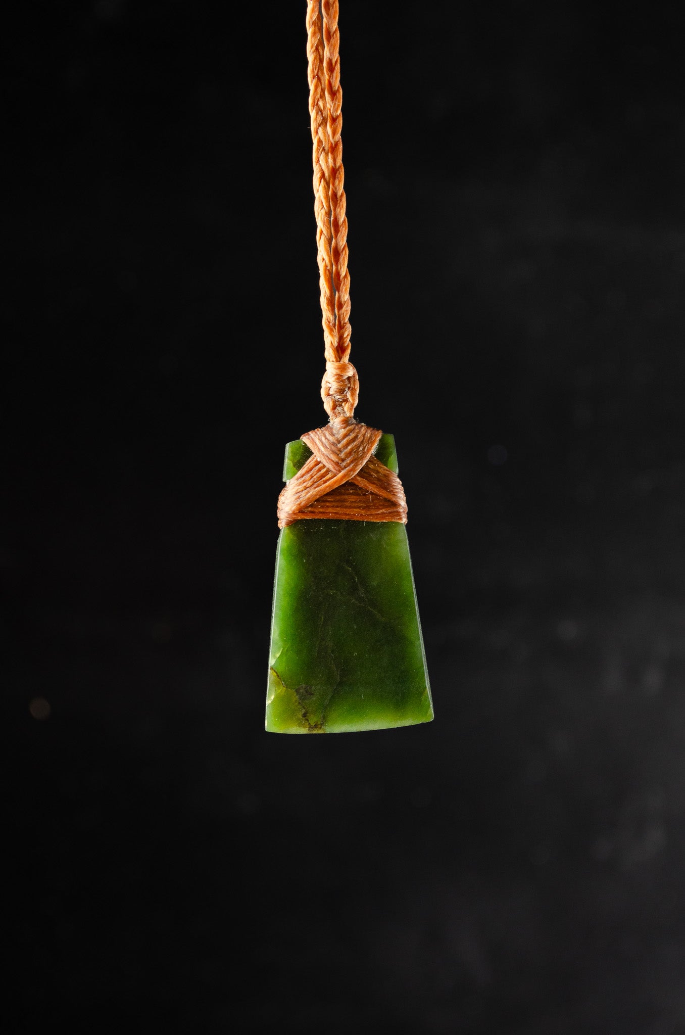 Pounamu pendant on plain background