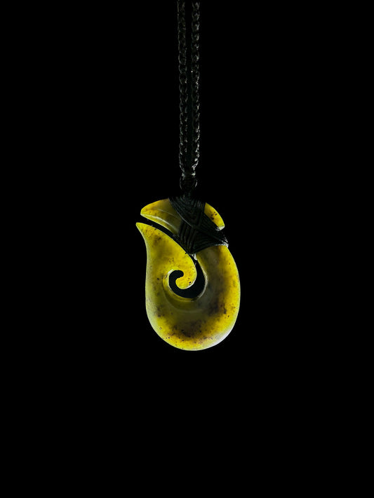 Hei Matau Pounamu Pendant on Black background