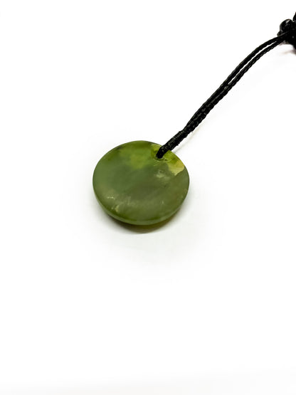 Back of Pounamu pendant on white background