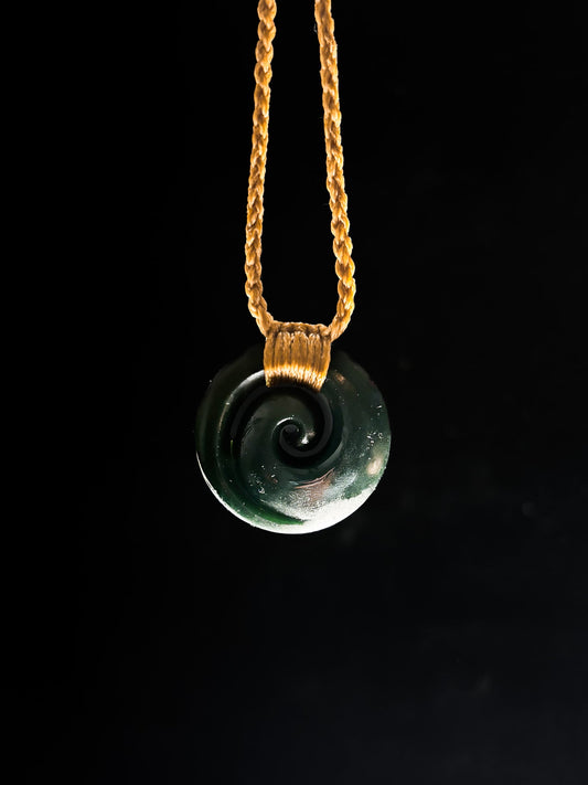 Pounamu Koru on plain background