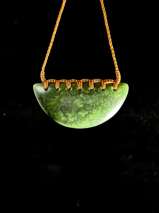 Pounamu Breastplate on plain background